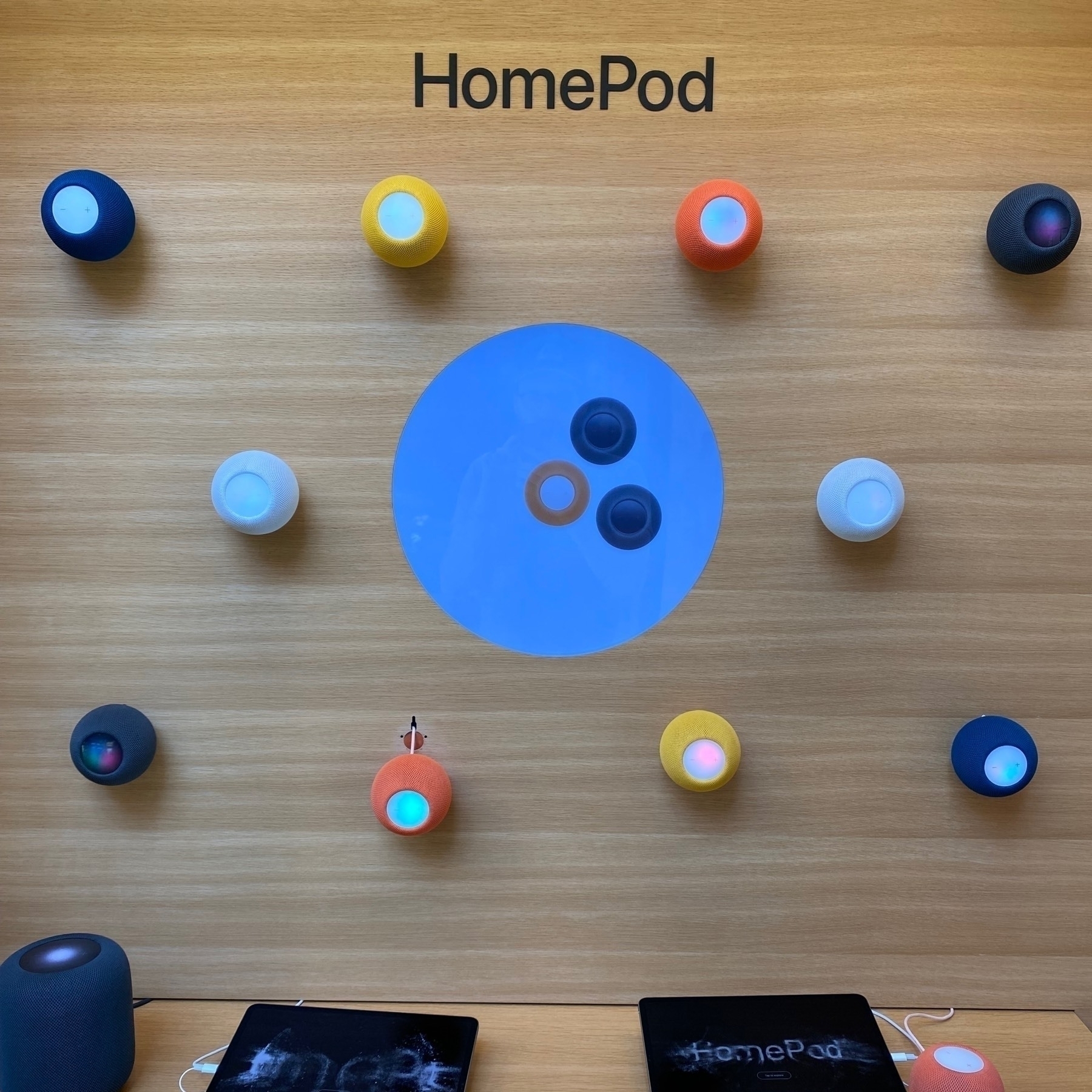 photograph, colored pattern of HomePods, wall mounted display at Apple Store